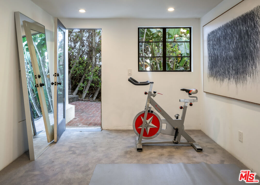 8420 Cresthill Road Los Angeles, CA 90069 - Photo 18 of 30 a view of a room with gym equipment