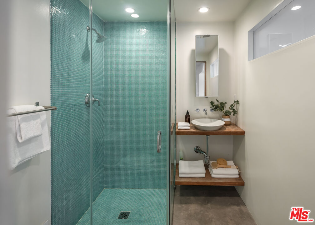 8420 Cresthill Road Los Angeles, CA 90069 - Photo 19 of 30 a bathroom with a sink a toilet and shower