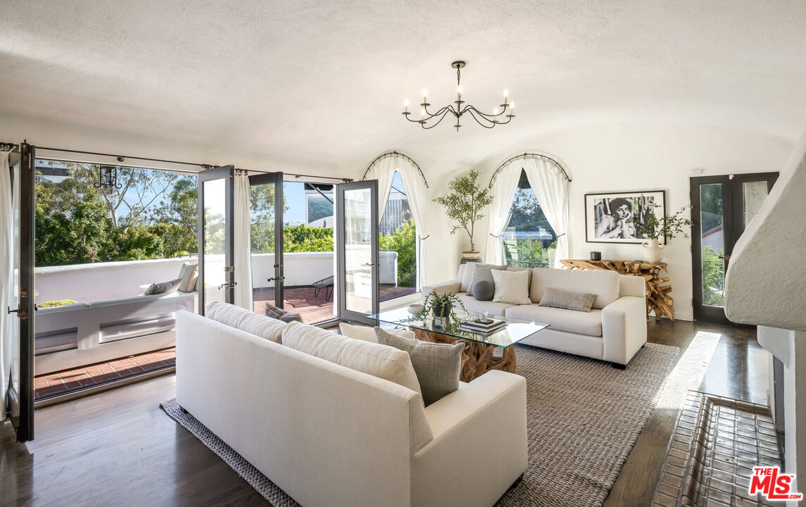 8420 Cresthill Road Los Angeles, CA 90069 - Photo 6 of 30 a living room with furniture and a large window