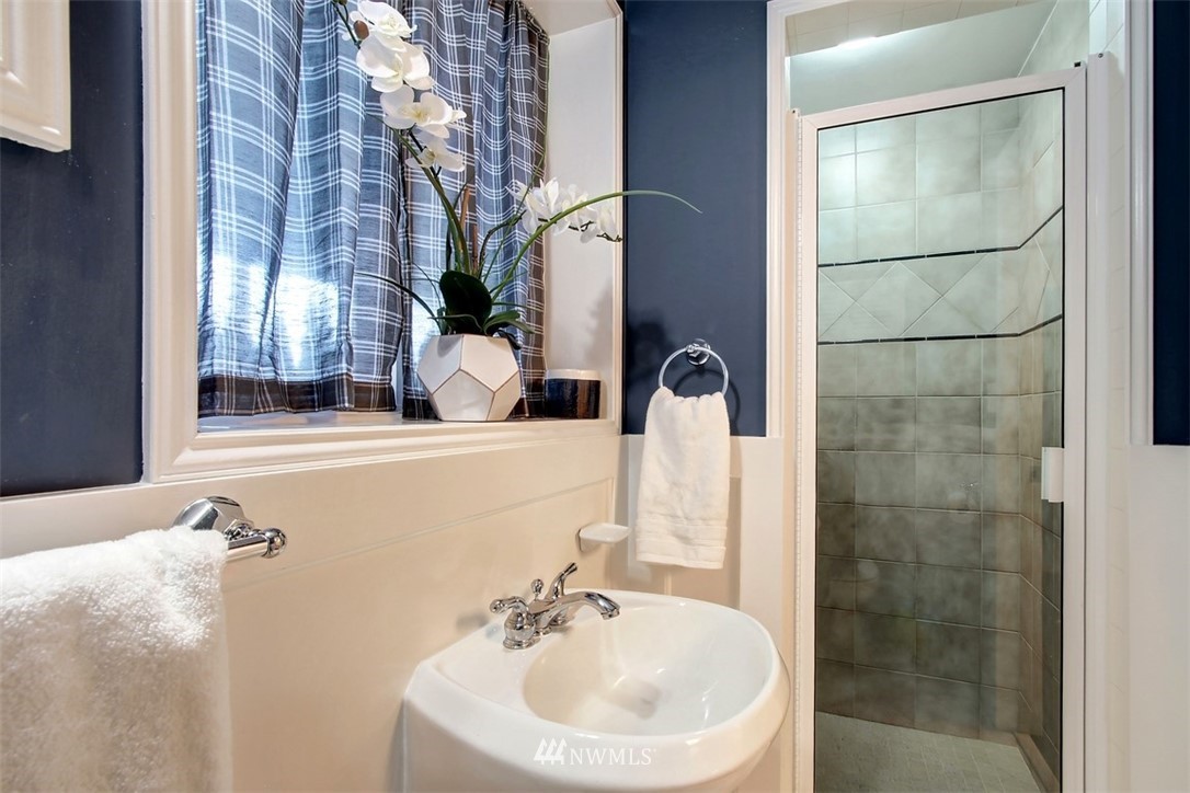 2004 26th Avenue West Seattle, WA 98199 - Photo 32 of 36 a bathroom with a sink and mirror