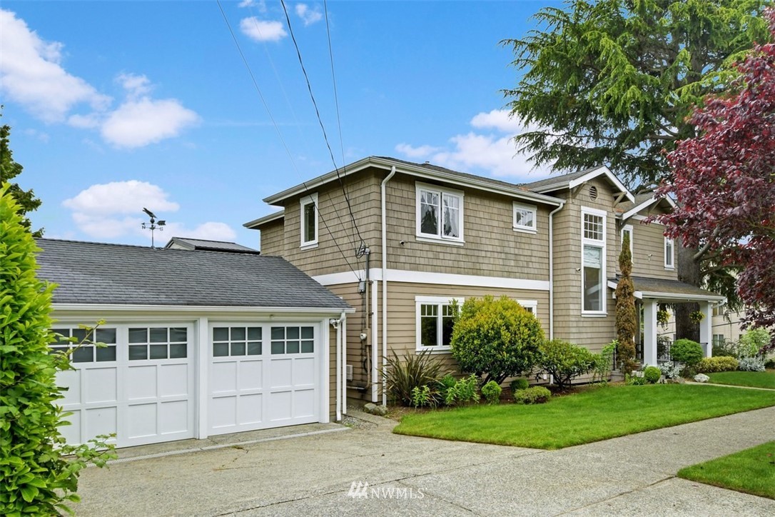2004 26th Avenue West Seattle, WA 98199 - Photo 36 of 36 a front view of a house with a yard