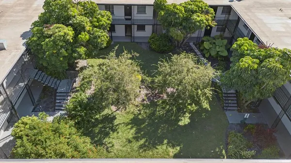 an aerial view of a house with yard
