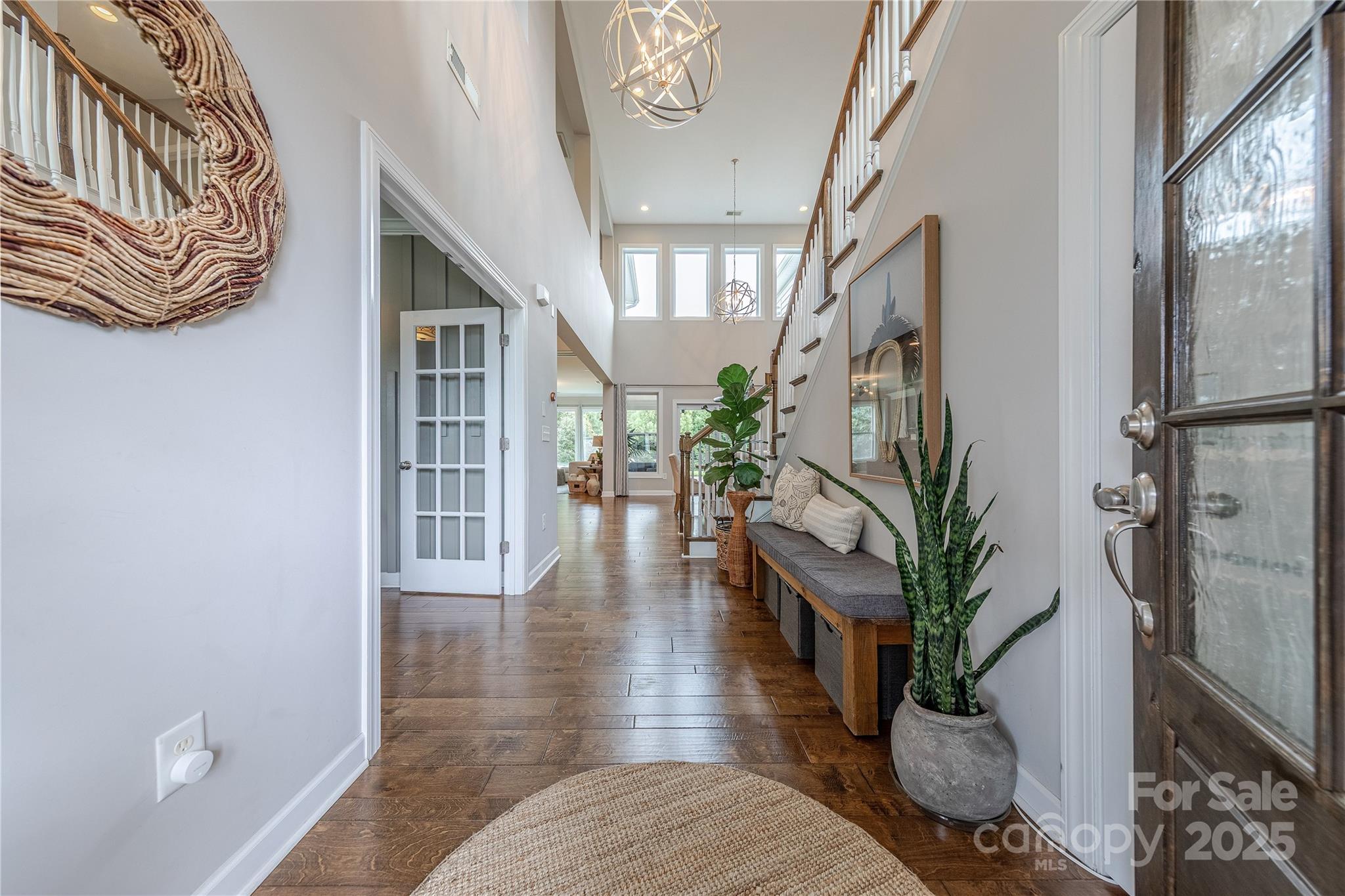 240 Hampton Trail Drive Fort Mill, SC 29708 - Photo 3 of 47 a hallway with wooden floor and a potted plant