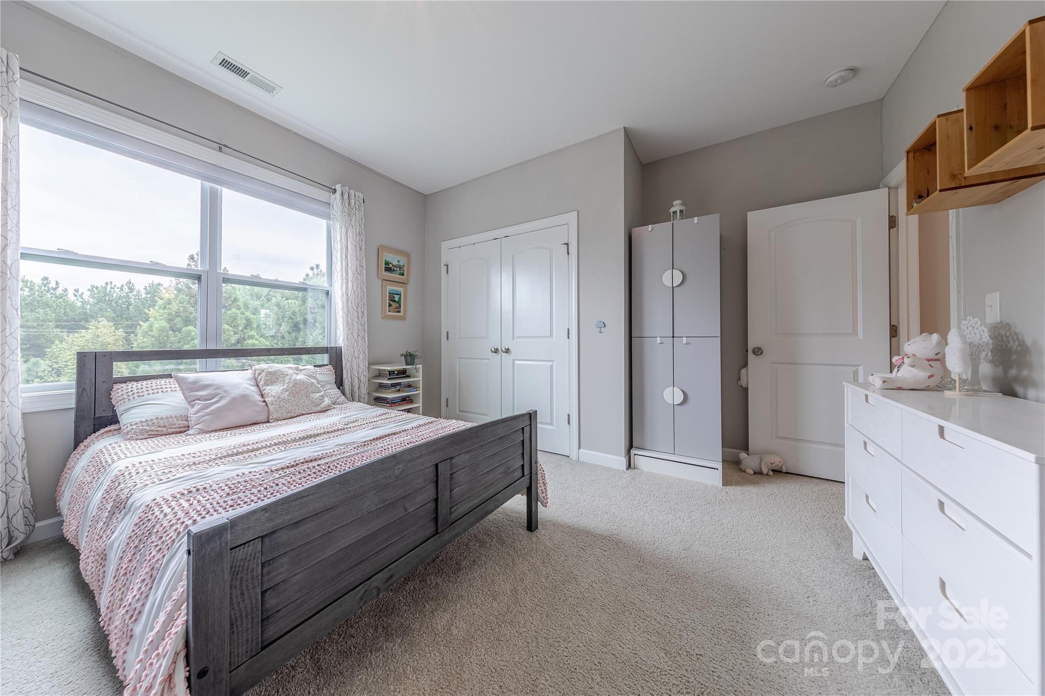 240 Hampton Trail Drive Fort Mill, SC 29708 - Photo 34 of 47 a spacious bedroom with a bed and a dresser