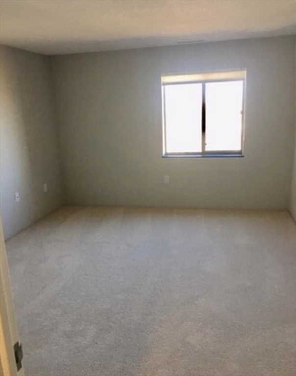 12 Melrose Terrace, Unit 5 Wakefield, MA 01880 - Photo 6 of 11 an empty room with a window