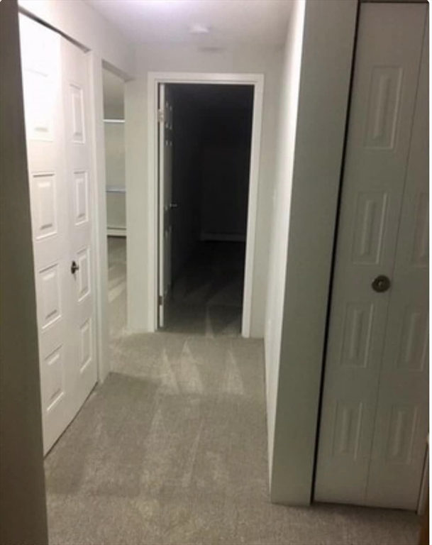 12 Melrose Terrace, Unit 5 Wakefield, MA 01880 - Photo 8 of 11 a view of a hallway to rooms