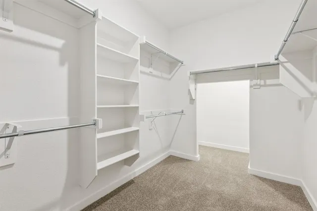 a view of an empty walk in closet
