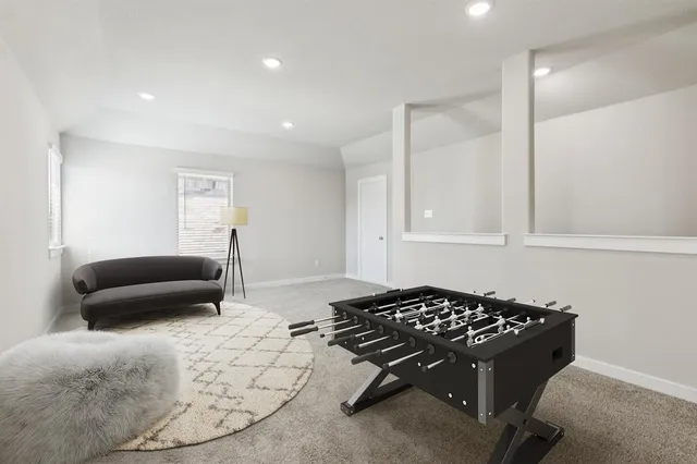 a bedroom with a bed and a couch