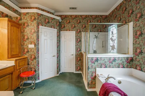 a bathroom with a tub and a shower