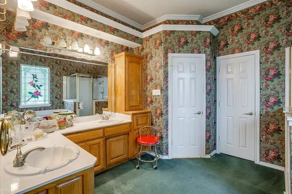 a bathroom with a sink a toilet and shower curtain