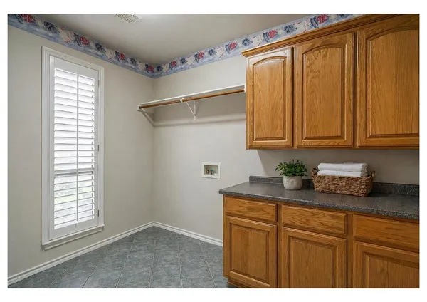 a kitchen with a table and chairs in it