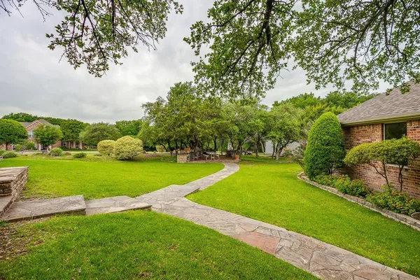 a view of a yard with an outdoor space