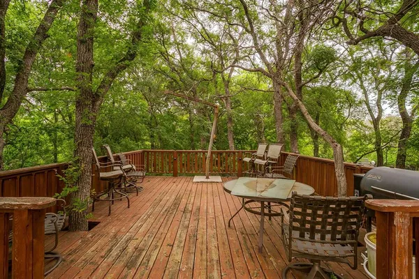 a view of a green field with an outdoor space