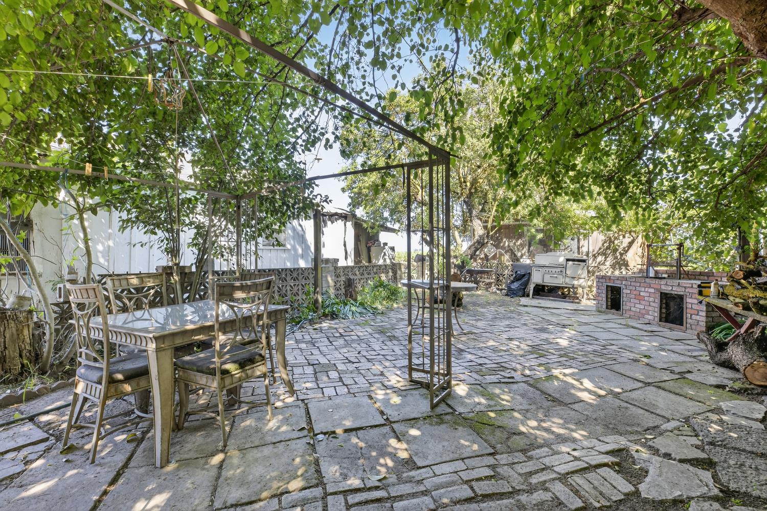 383 Taylor Road Lodi, CA 95242 - Photo 14 of 22 a view of a backyard with sitting area