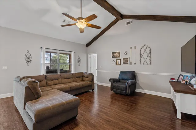 a living room with furniture and a window