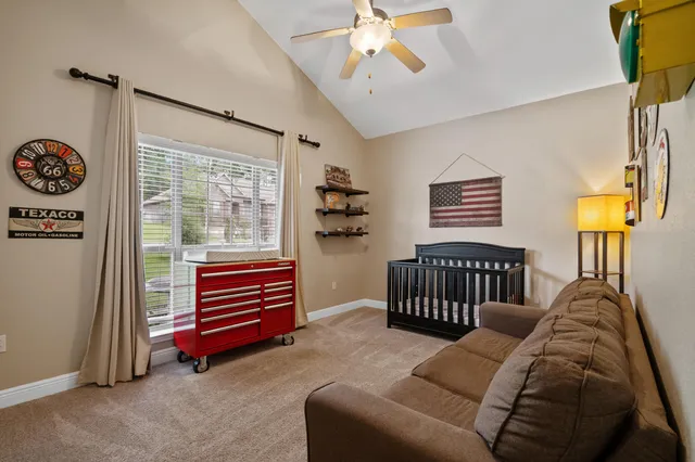 a bedroom with furniture and a window