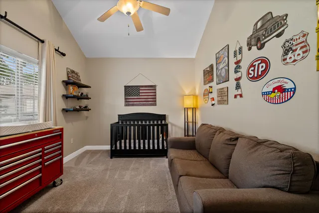 a bedroom with furniture and a window