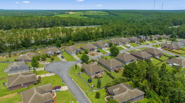 an aerial view of a house with a garden