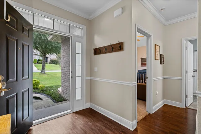 a view of a porch with wooden floor and doors