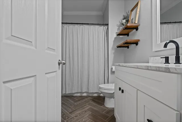 a bathroom with a sink and toilet