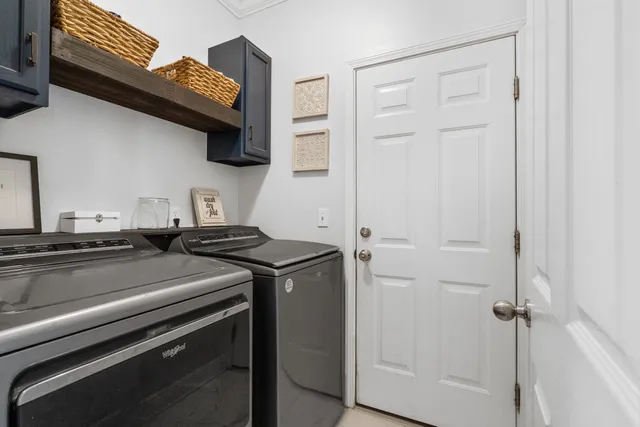 a kitchen with a stove and a microwave