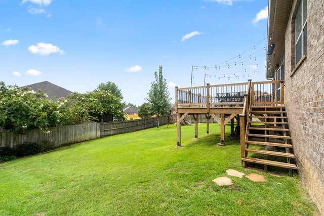a view of a garden with lawn chairs