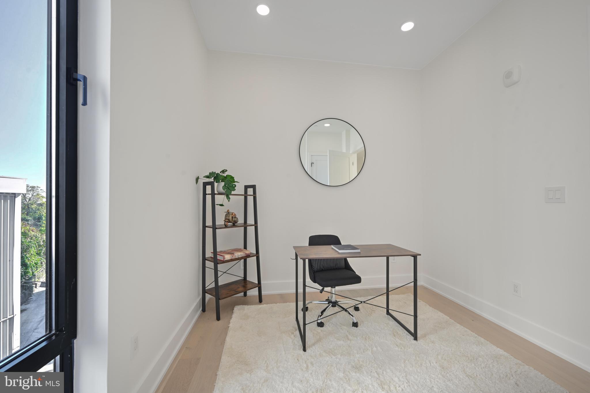 517 Montana Avenue Northeast, Unit 3C Washington, DC 20017 - Photo 17 of 54 a view of a room with table and a chair