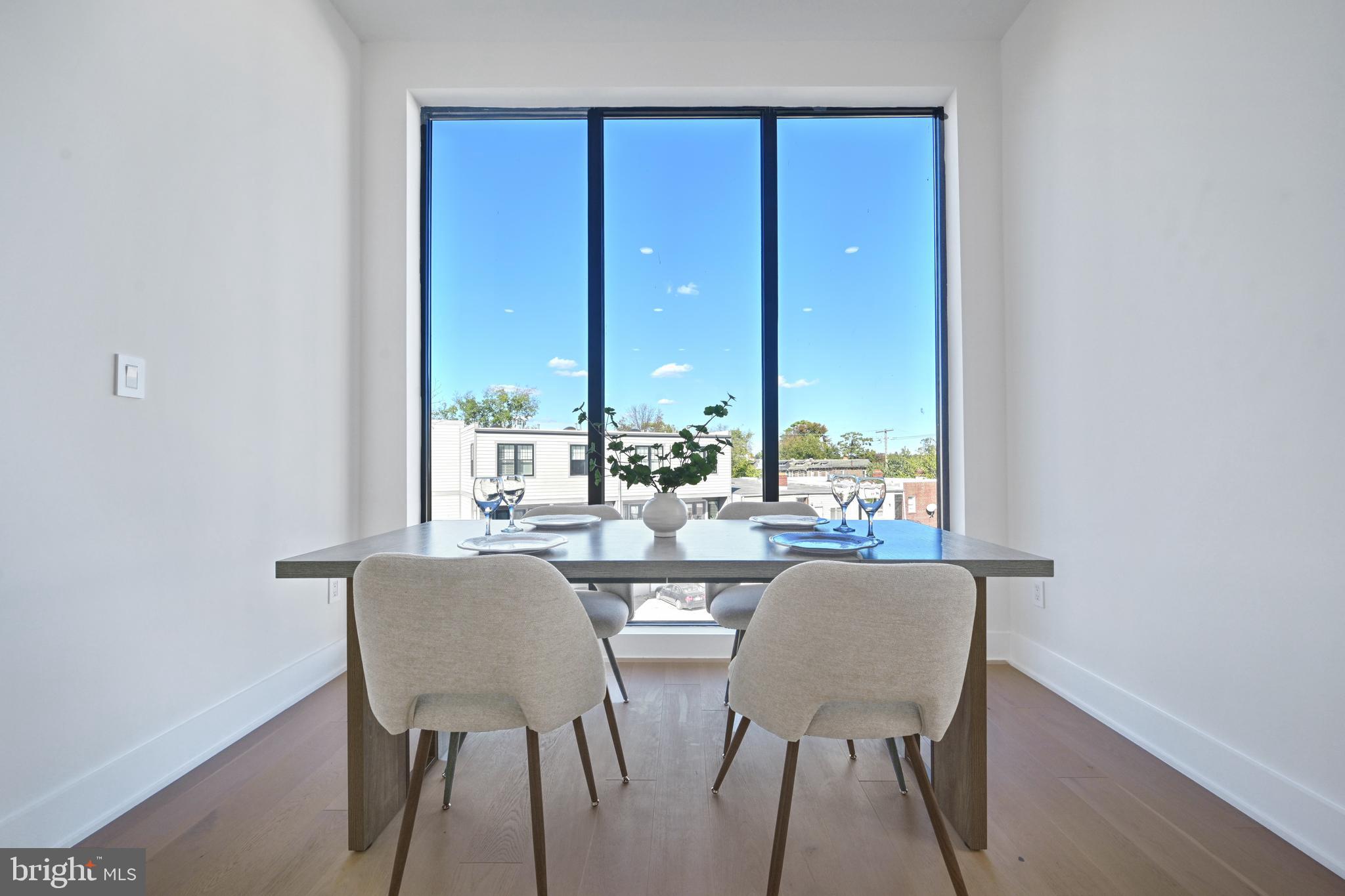 517 Montana Avenue Northeast, Unit 3C Washington, DC 20017 - Photo 5 of 54 a view of a dining room with furniture and window
