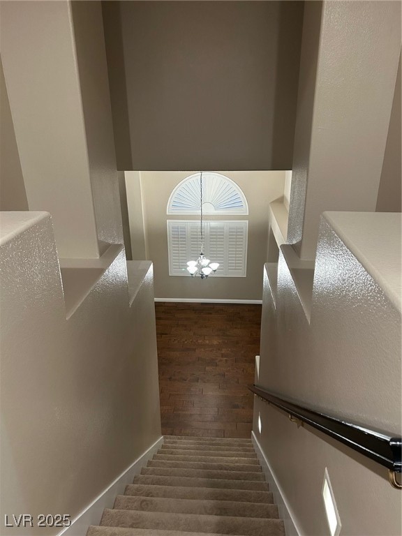 1008 Ridgegate Street Henderson, NV 89002 - Photo 43 of 46 Stairs with a chandelier