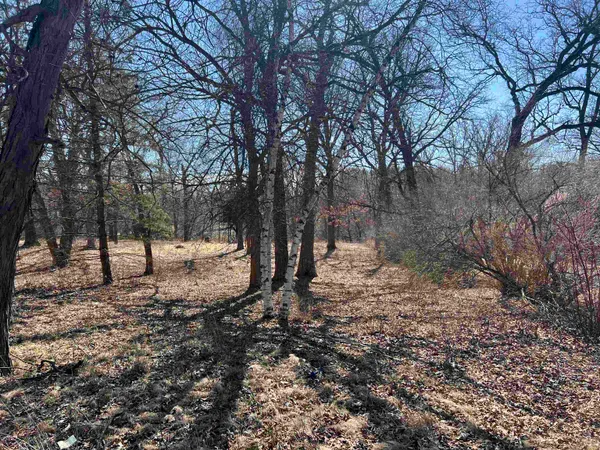 a sign board on the side of the road