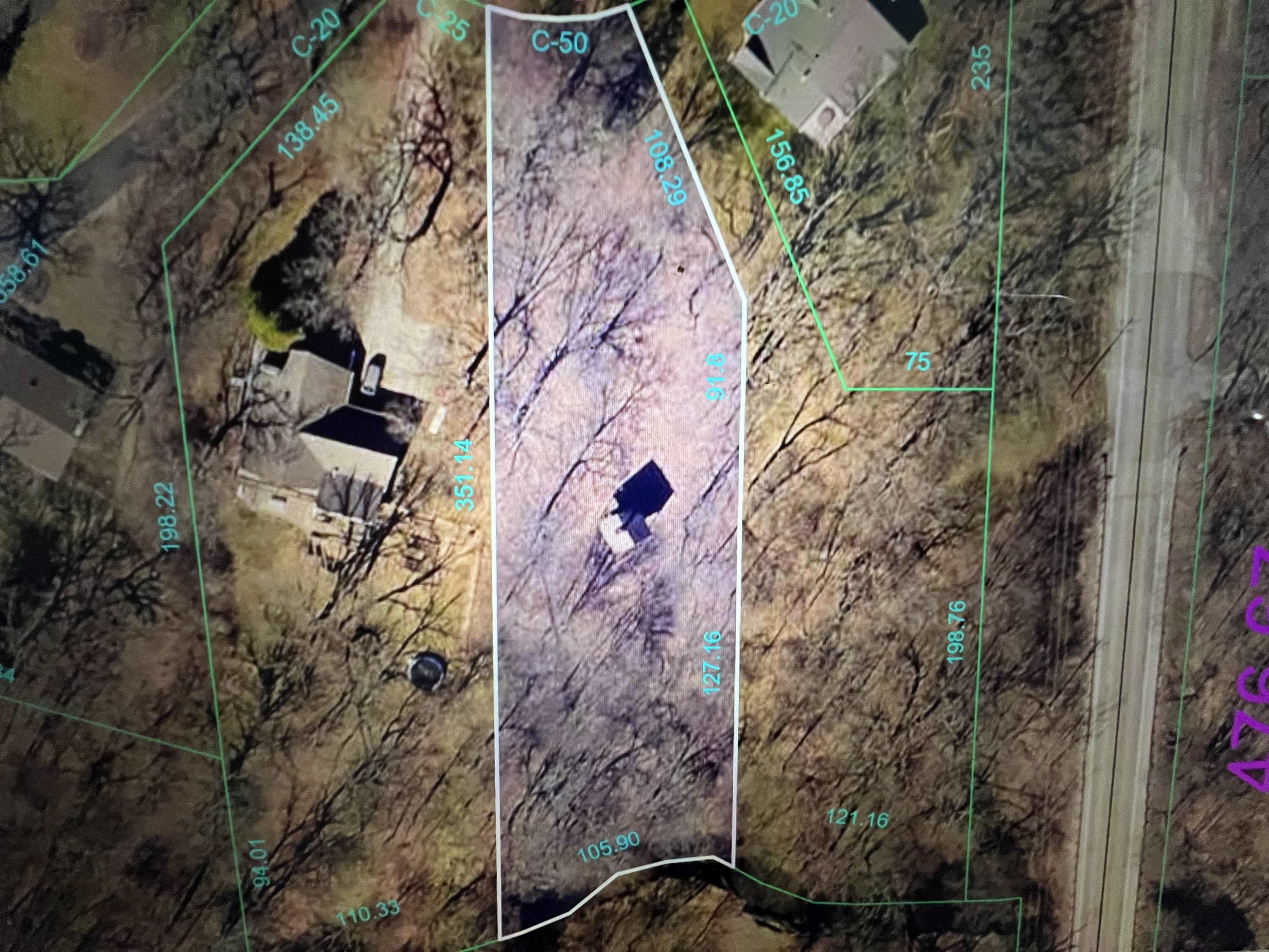 16524 Grove Creek Circle Pecatonica, IL 61063 - Photo 7 of 8 a aerial view of a house with a yard and large trees