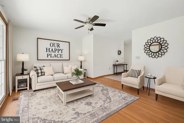a living room with furniture and a rug