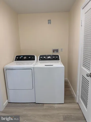 a utility room with washer and dryer