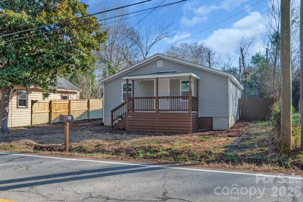 a house with trees in the background