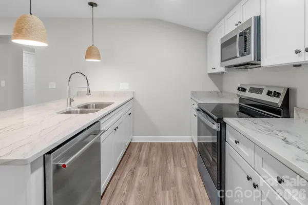 a kitchen with a sink and cabinets