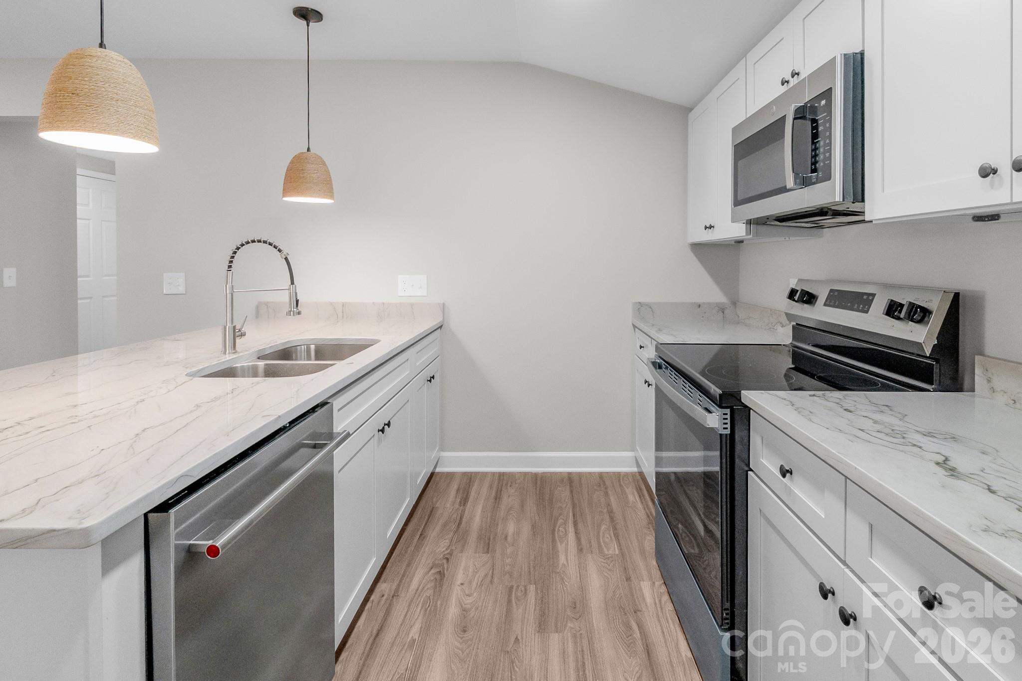 401 Golf Course Road Winnsboro, SC 29180 - Photo 12 of 39 a kitchen with a sink and cabinets