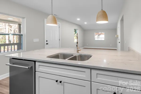 a kitchen with a sink and a window