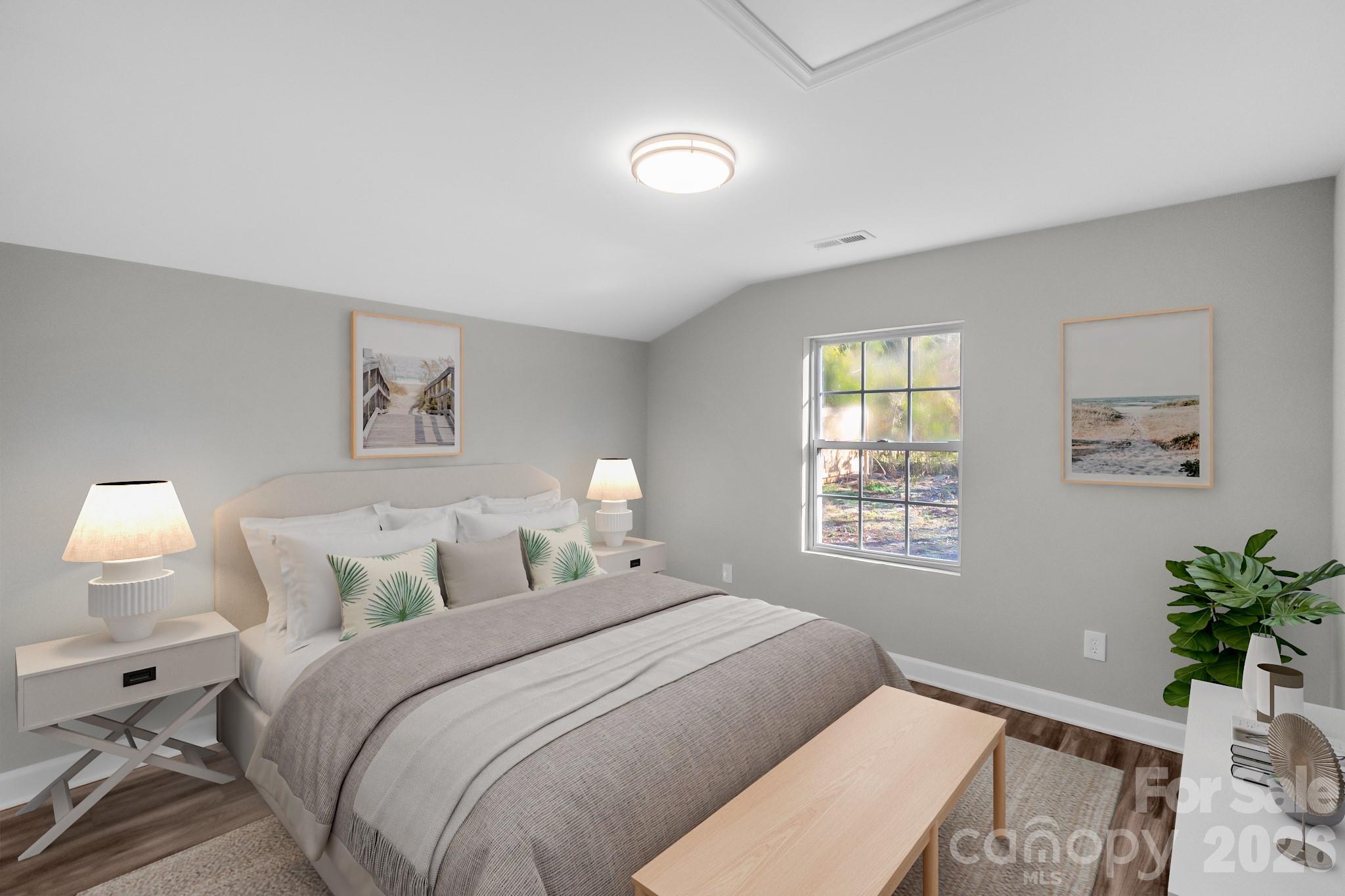 401 Golf Course Road Winnsboro, SC 29180 - Photo 32 of 39 a bedroom with a bed and a potted plant