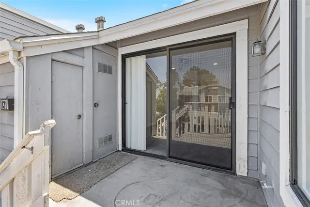 a view of a bathroom with a glass door and a porch