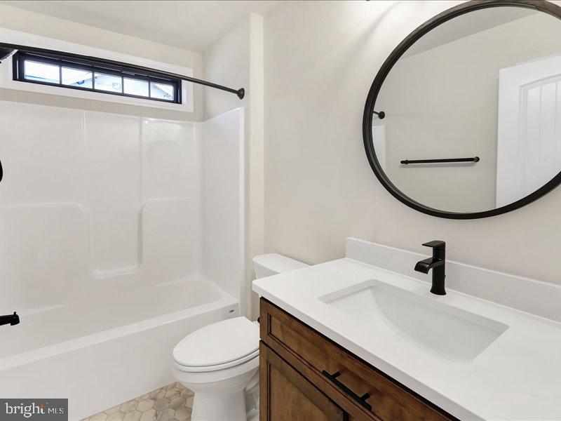 13 Rolling Meadow Road Lebanon, PA 17046 - Photo 26 of 31 a bathroom with a sink a toilet and a mirror