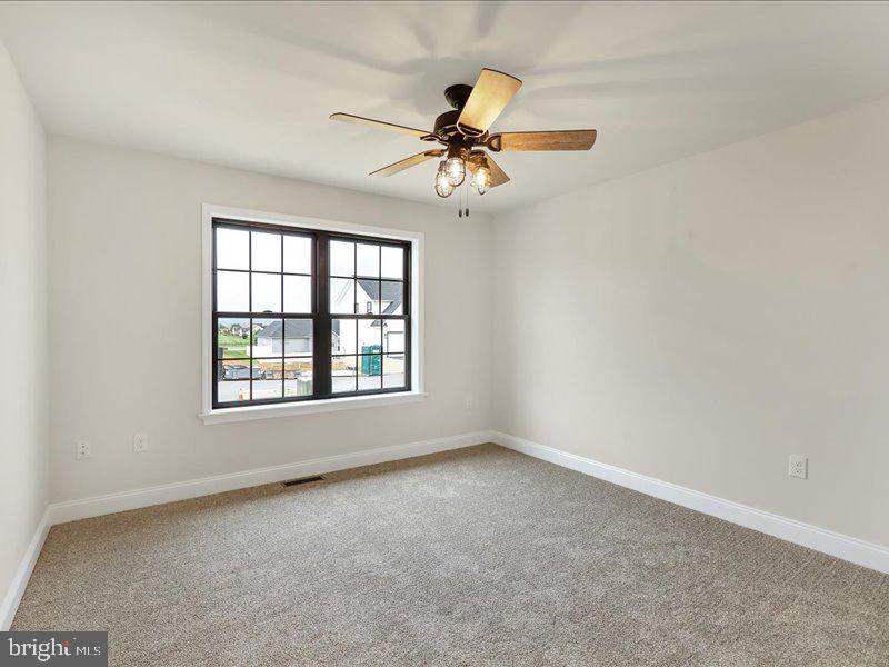 13 Rolling Meadow Road Lebanon, PA 17046 - Photo 29 of 31 an empty room with a window and a fan