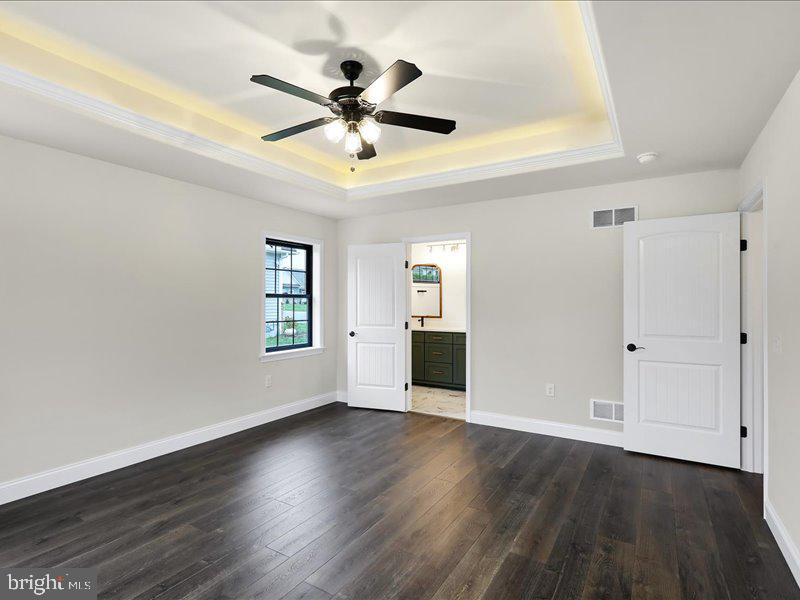 13 Rolling Meadow Road Lebanon, PA 17046 - Photo 5 of 31 a view of an empty room with wooden floor and a window