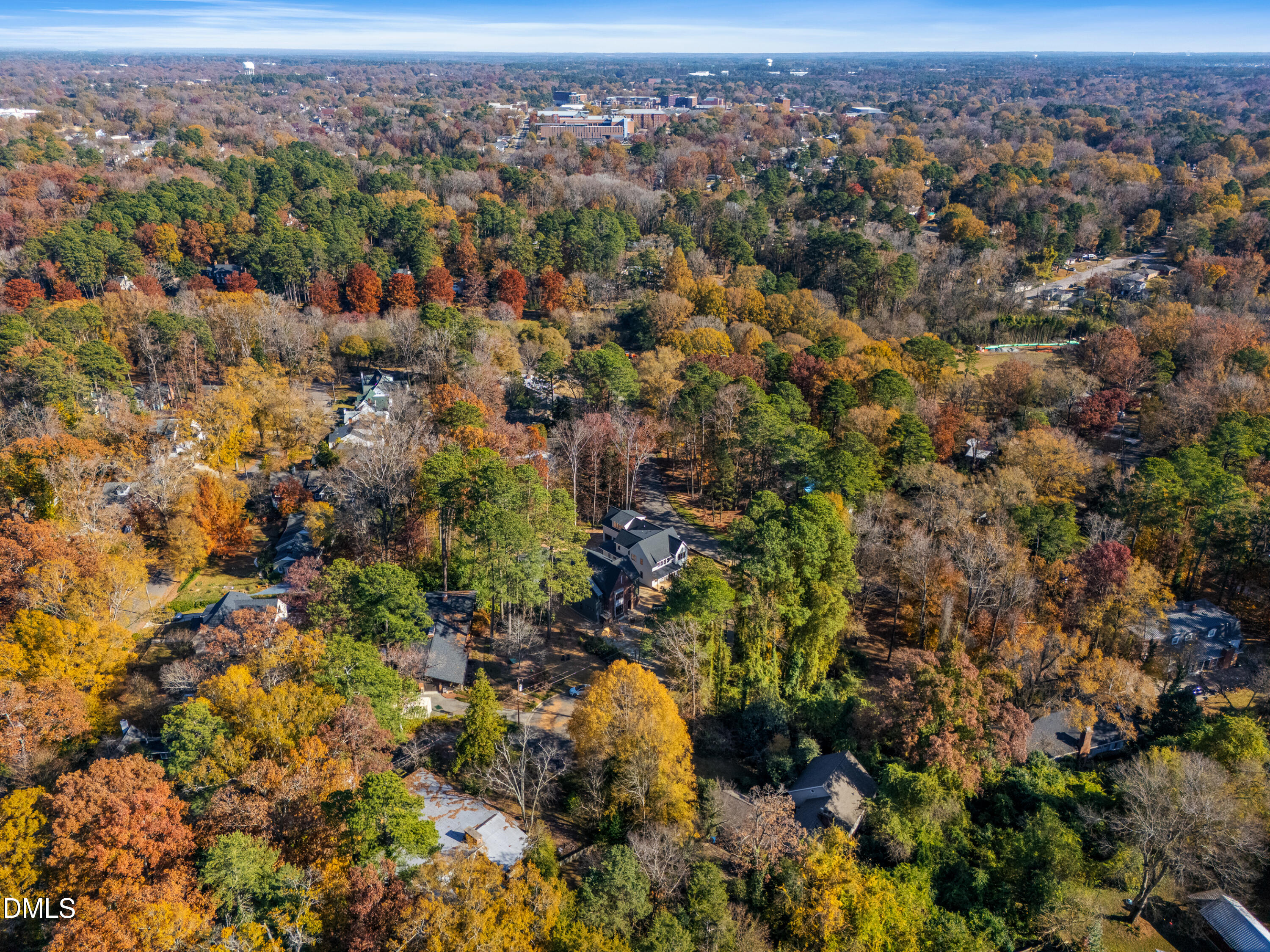 4 Chantilly Place Durham, NC 27707 - Photo 14 of 16 an aerial view of a houses with a lush green hillside