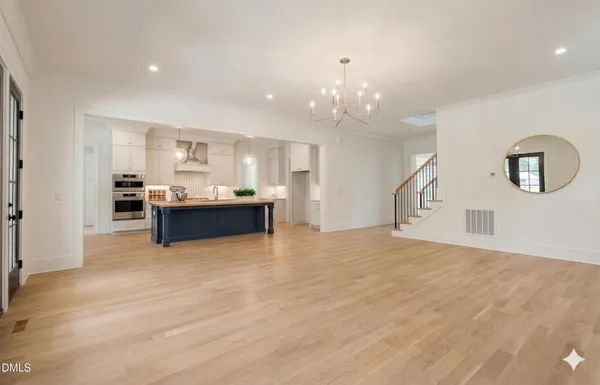 an empty room with closet and a bathroom
