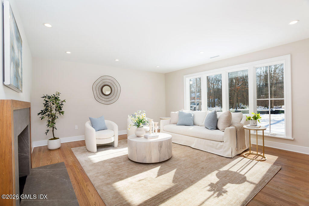 49 Salisbury Road Darien, CT 06820 - Photo 13 of 40 a living room with furniture and a large window