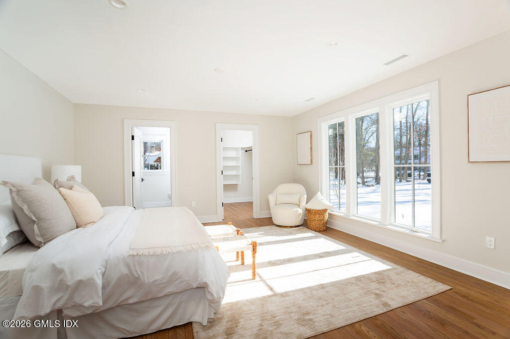 49 Salisbury Road Darien, CT 06820 - Photo 19 of 40 a bedroom with a bed and wooden floor