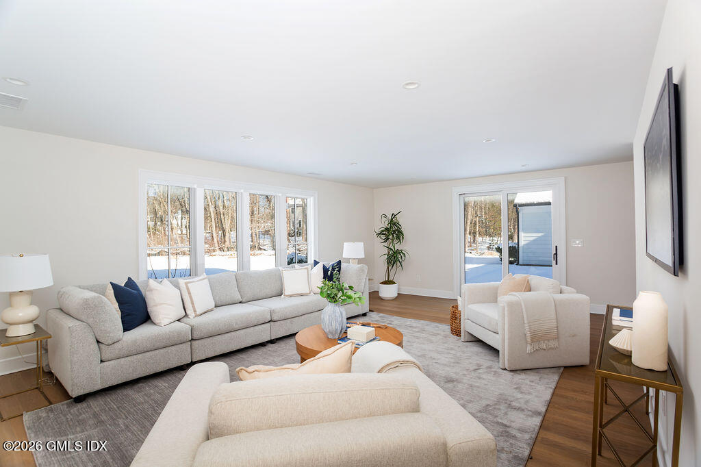 49 Salisbury Road Darien, CT 06820 - Photo 27 of 40 a living room with furniture and a large window