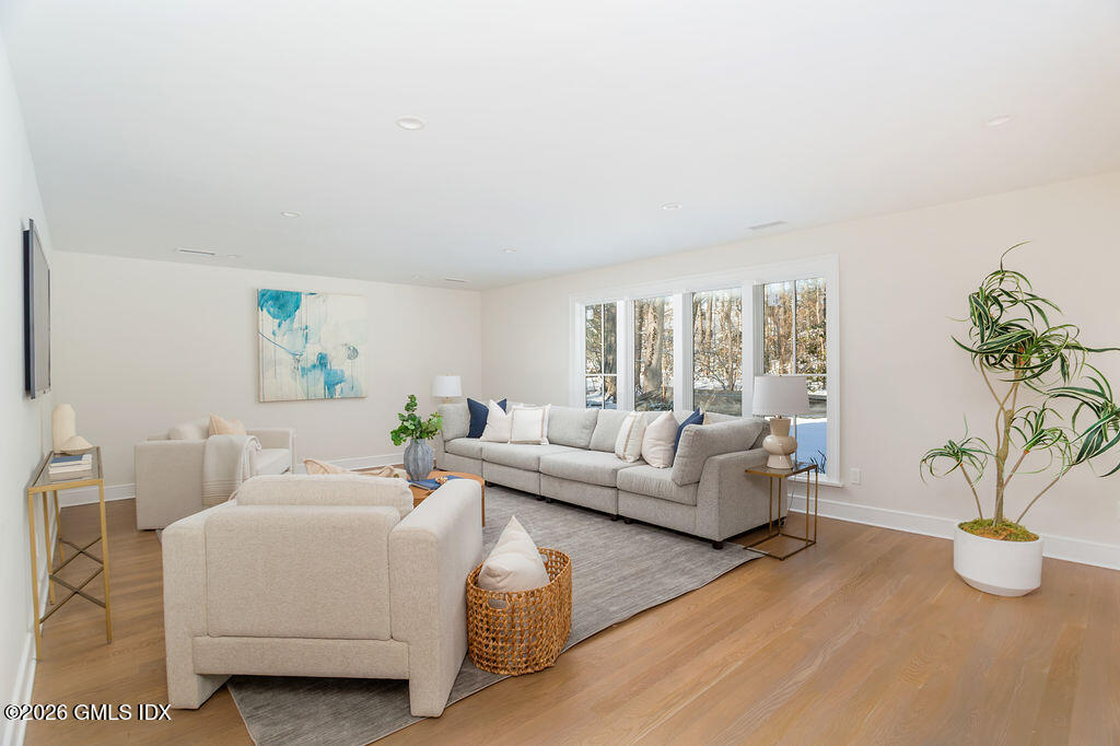 49 Salisbury Road Darien, CT 06820 - Photo 28 of 40 a living room with furniture and potted plant