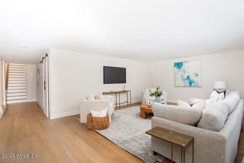 49 Salisbury Road Darien, CT 06820 - Photo 29 of 40 a living room with furniture and a flat screen tv