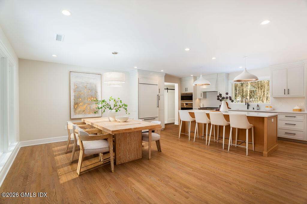 49 Salisbury Road Darien, CT 06820 - Photo 4 of 40 a view of a dining room with furniture and wooden floor